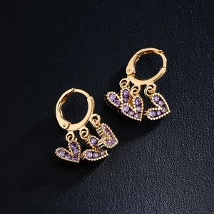 18K gold plated copper earrings with three purple heart zircon charms on black background