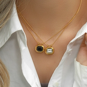 Layered 18K gold plated stainless steel necklaces with black and white zircon pendants