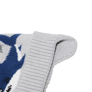 Macro view of warm ribbed knit and jacquard patterns on children's winter ski hat