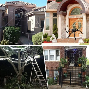 Outdoor Halloween decoration set with giant white spider webs and black spiders on porch