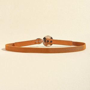 Detail view of a thin elastic brown waist belt with a round silver metal buckle