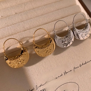 Geometric stainless steel hoop earrings in gold and silver with hammered metal texture
