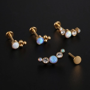 5-piece set of gold titanium 16G labret studs with white opal and clear crystal zircon gems