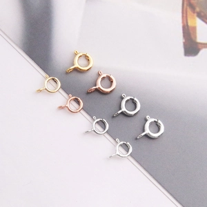 Detailed macro view of S925 sterling silver spring ring clasps in gold and rose gold
