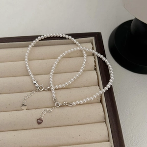 Elegant S925 sterling silver pearl bracelets with heart pendants in a velvet jewelry box