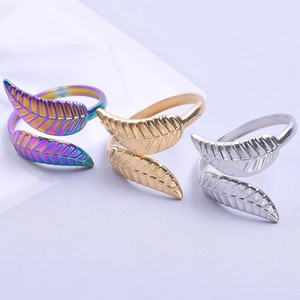 Three-piece leaf open rings set in rainbow, rose gold, and silver stainless steel finishes