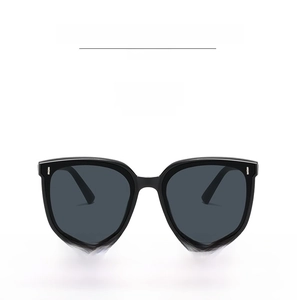 Front view of black oversized square sunglasses with gray lenses and silver rivets