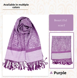 Detail of purple paisley jacquard pashmina shawl with fringes and soft cashmere feel