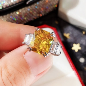 Macro shot of 10x12 rectangular aquamarine zircon ring with baguette side stones in a gift box
