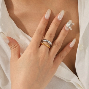 Dual-layer minimalist gold and silver stainless steel rings worn on hand for women