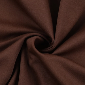 Close-up of deep brown high-stretch knit fabric showing soft texture and fine stitching