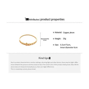Detail view of 18k gold plated bangle featuring cubic zirconia and cuban chain design