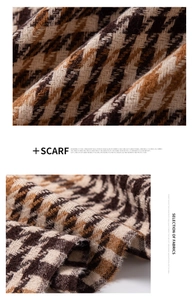 Detailed macro shot showing the soft texture and weave of houndstooth plaid scarf fabric