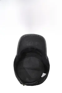 Detail view of the breathable mesh lining and interior label of a black military cap