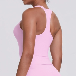 Detailed side view of pink racerback sports bra showing fit and fabric texture