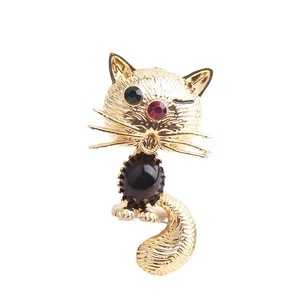 Charming golden cat brooch with black enamel and sparkling green rhinestone eyes