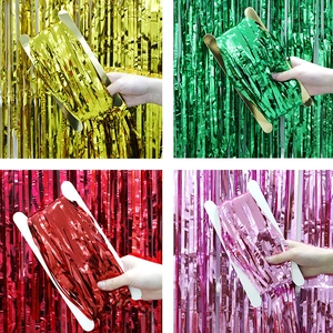 Multi-color metallic foil fringe curtains in gold, green, red, and pink for party backdrop