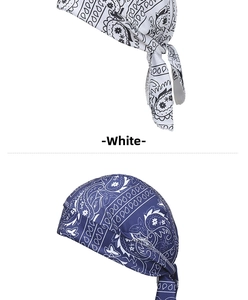 Detail view of white and navy blue paisley bandana caps with stretch fabric straps