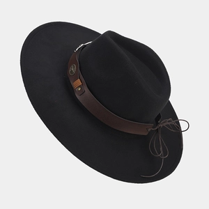 Detail of black wool felt fedora hat featuring brown leather band and metal buckle