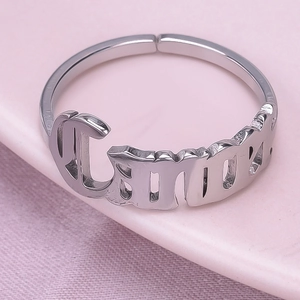 Macro shot of adjustable 304 stainless steel ring with polished hollow letter design