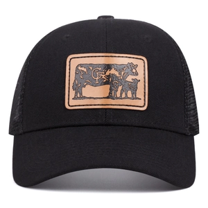 Black trucker hat with mesh back and leather patch featuring a cow silhouette design