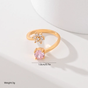 Detailed view of leaf design gold ring with zircon flowers and pink stone dimensions