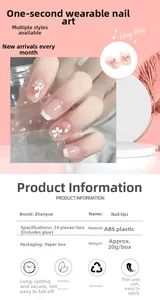 Close-up of pink camellia press-on nails set with French tips and 24 pieces per box