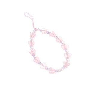Close-up of pink butterfly acrylic beads and imitation pearls on a mobile phone strap
