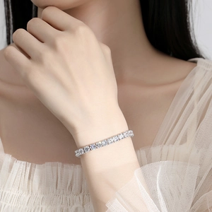 Elegant 925 sterling silver D color moissanite tennis bracelet worn on a female wrist