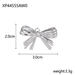 Macro shot of silver bow pendant with 2.0cm height and 3.0cm width dimensions