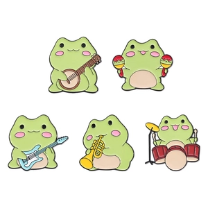 Set of 5 cartoon green frog enamel pins playing musical instruments on white background