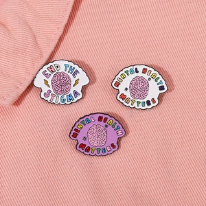 Pins en émail pour la santé mentale avec illustrations colorées de cerveau et slogans