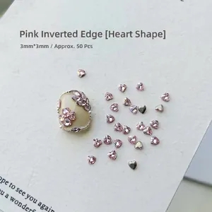 Macro shot of 50pcs pink heart-shaped nail rhinestones with 3x3mm precision cutting detail