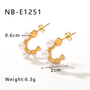 Detail view of C-shaped titanium earrings with pearls and dimensions 2cm by 0.6cm
