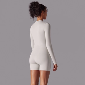 Rear view detail of the light gray long sleeve bodysuit highlighting tight fit and high neck