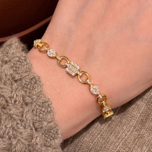 Elegant gold zircon bracelet with square and marquise crystals shown on wrist