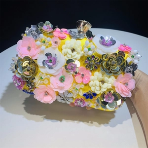 Detail of handmade 3D floral beaded evening clutch with crystals and sequins decoration