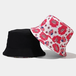 Detail showing high-quality stitching on black and floral reversible cotton sun hats