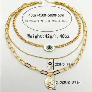 Triple-layered stainless steel necklace with evil eye, hamsa hand and portrait pendants