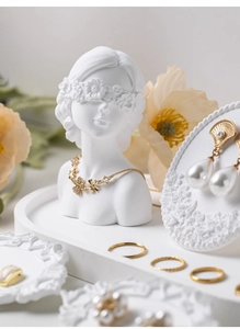 Chic white plaster statue display with gold flower necklace and pearl earrings set