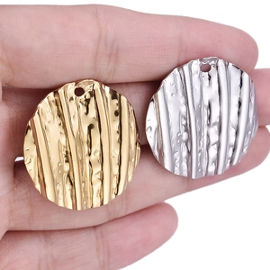 Textured round 304 stainless steel pendants in gold and silver finish with hanging holes