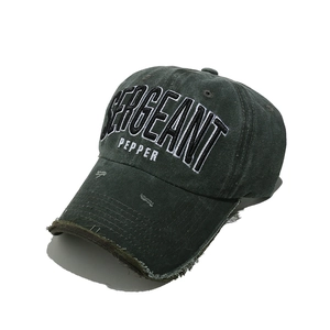 Detail of vintage washed cotton baseball cap with high-density Sergeant Pepper embroidery