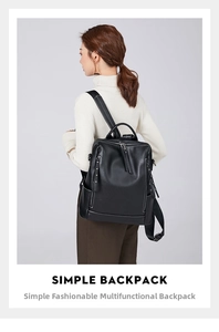 Rear view of a black pebbled leather backpack with silver zippers on a model in a white top