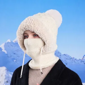 Winter knitted balaclava for women featuring a faux fur pompom and adjustable neck drawstring