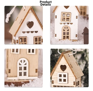 Detail of wooden Christmas house ornaments with heart cutouts and hanging ropes