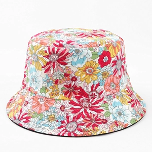 Close-up of reversible cotton bucket hat with colorful floral pattern and fine stitching