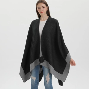 Full view of elegant black and grey split cape shawl styled with white top and denim jeans