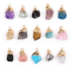 Set of 15 natural crystal stone pendants with gold plated clasps on a white background