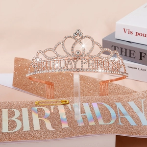 Detailed macro view of rose gold birthday princess tiara and pink glitter sash