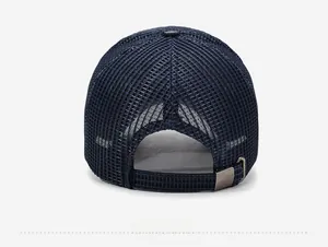 Detail view of the breathable mesh back and adjustable metal buckle on a navy baseball cap